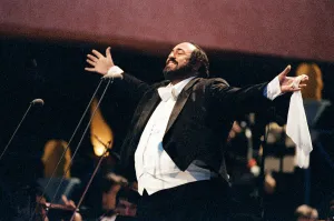 Luciano Pavarotti, the Italian operatic tenor, singing at an outdoor concert in Luciano Pavarotti, the Italian operatic tenor, singing at an outdoor concert in