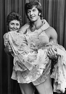 Lulu being lifted and cuddled by the arms of Strong Man Dave Prowse. October 1973 P035537 Lulu being lifted and cuddled by the arms of Strong Man Dave Prowse. October 1973 P035537