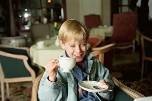 Images Dated 18th October 1991: Macaulay Culkin sips his tea as he toasts his membership of he million-dollar-a movie