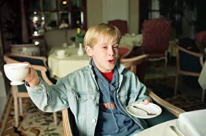 Images Dated 18th October 1991: Macaulay Culkin sips his tea as he toasts his membership of he million-dollar-a movie