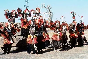 Mali Dogon Tribe Dancers outside Sanga Village await entrance to dance Mali Dogon Tribe Dancers outside Sanga Village await entrance to dance