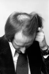 Man combing his hair. July 1975 75-00177-006 Man combing his hair. July 1975 75-00177-006