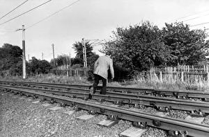A man crossing the railway line illegally on 13th May 1981 A man crossing the railway line illegally on 13th May 1981