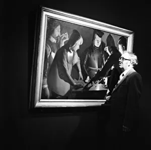 A man views The Dice Players by Georges de La Tour in Middlesbrough. 1973 A man views The Dice Players by Georges de La Tour in Middlesbrough. 1973