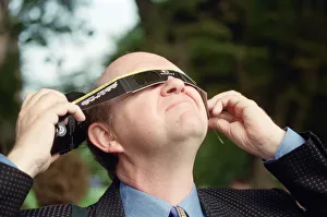 A man watching the solar eclipse in Chester. 11th August 1999 A man watching the solar eclipse in Chester. 11th August 1999