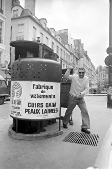 A man waves as he walks out of a public convenience in Paris A man waves as he walks out of a public convenience in Paris