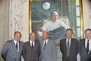 Manchester United director Bobby Charlton (centre) standing in front of a painting of him Manchester United director Bobby Charlton (centre) standing in front of a painting of him