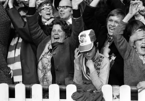 Manchester United Fan wearing George Best hat March 1972 is surrounded by Stoke City fans Manchester United Fan wearing George Best hat March 1972 is surrounded by Stoke City fans