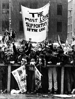 Manchester United fans line the streets as they await the return of their team following Manchester United fans line the streets as they await the return of their team following