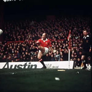 Manchester United footballer Bobby Charlton takes a corner during his last game at Old Manchester United footballer Bobby Charlton takes a corner during his last game at Old
