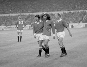 Manchester United footballer George Best is consoled by teammates Tony Dunne (left Manchester United footballer George Best is consoled by teammates Tony Dunne (left