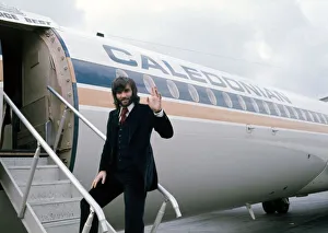 Manchester United footballer George Best waves before boarding his plane October Manchester United footballer George Best waves before boarding his plane October
