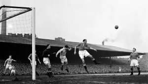 Manchester United versus Manchester City at Old Trafford Bill Foulkes clears United lines Manchester United versus Manchester City at Old Trafford Bill Foulkes clears United lines