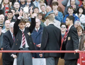Manchester United youth team footballer Gary Neville holds aloft the Lancashire League Manchester United youth team footballer Gary Neville holds aloft the Lancashire League