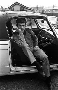 Manchester United's Brian Kidd listening to the FA Cup draw on his car radio Manchester United's Brian Kidd listening to the FA Cup draw on his car radio