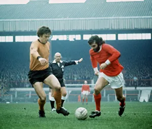 Manchester Uniteds George Best (right) 1971 and Wolves F Munroe challenging for the ball Manchester Uniteds George Best (right) 1971 and Wolves F Munroe challenging for the ball