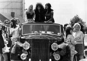 Marc Bolan pop singer rides roof of Rolls Royce 1972 Marc Bolan pop singer rides roof of Rolls Royce 1972