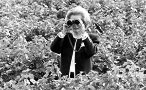 Margaret Thatcher looking through binoculars on a fruit farm - May 1987 Margaret Thatcher looking through binoculars on a fruit farm - May 1987