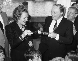 MARGARET THATCHER AND NEIL KINNOCK PULL A CRACKER AT A CHILDREN' MARGARET THATCHER AND NEIL KINNOCK PULL A CRACKER AT A CHILDREN'