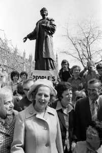 Margaret Thatcher in Pankhurst Gardens outside the Houses of Parliament standing under Margaret Thatcher in Pankhurst Gardens outside the Houses of Parliament standing under