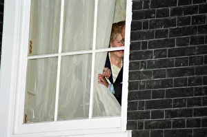 Margaret Thatcher watches John Major from a window at 10 Downing Street after he won Margaret Thatcher watches John Major from a window at 10 Downing Street after he won