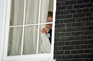 Margaret Thatcher watches John Major from a window at 10 Downing Street after he won Margaret Thatcher watches John Major from a window at 10 Downing Street after he won