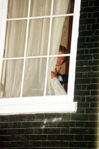 Margaret Thatcher watches through the window at No 10 Downing Street 1990 Margaret Thatcher watches through the window at No 10 Downing Street 1990