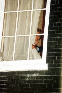 Margaret Thatcher watches through the window at No 10 Downing Street 1990 Margaret Thatcher watches through the window at No 10 Downing Street 1990