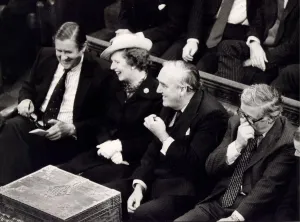 Margaret Thatcher with William Whitelaw and Sir Geoffrey Howe laughing on front bench in Margaret Thatcher with William Whitelaw and Sir Geoffrey Howe laughing on front bench in