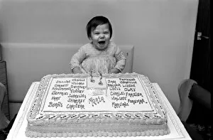 Images Dated 28th February 1975: Maria Browns celebrates her first birthday. Marias father, a boxing enthusiast