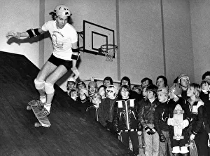 Mark Howard demonstrates his skateboarding skill to an appreciative audience at West Mark Howard demonstrates his skateboarding skill to an appreciative audience at West