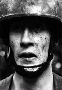 A member of the British Army's Parachute regiment seen here splattered with mud A member of the British Army's Parachute regiment seen here splattered with mud