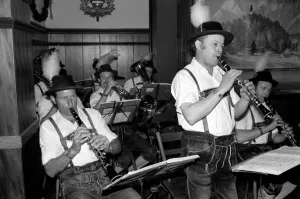 Members of a Bavarian band performing wearing traditional Bavarian dress during a night Members of a Bavarian band performing wearing traditional Bavarian dress during a night
