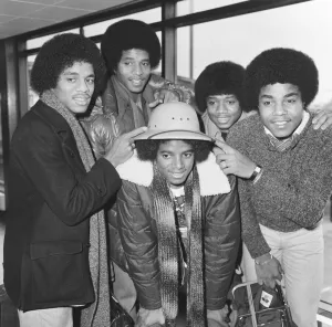 Members of The Jackson Five pop group make their way through the arrivals hall as they Members of The Jackson Five pop group make their way through the arrivals hall as they