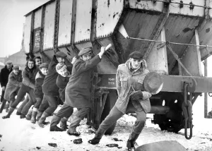 These men are trying to make a quick getaway with this rail truck full of coal during These men are trying to make a quick getaway with this rail truck full of coal during