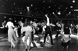 Men and women disco dancing in dance hall - October 1978 Dancing - Disco dancing Men and women disco dancing in dance hall - October 1978 Dancing - Disco dancing