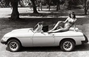 MGB Convertable Sport 1975 - Motors - Motor Cars Car sexy model posing on top MGB Convertable Sport 1975 - Motors - Motor Cars Car sexy model posing on top
