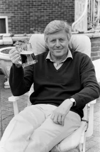 Michael Aspel relaxes at home. 31st May 1988 Michael Aspel relaxes at home. 31st May 1988