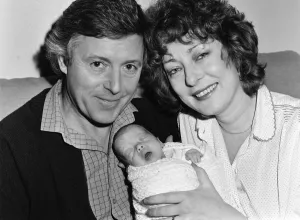 Michael Aspel and his wife Lizzie Power with their newborn son, Patrick Michael Aspel and his wife Lizzie Power with their newborn son, Patrick
