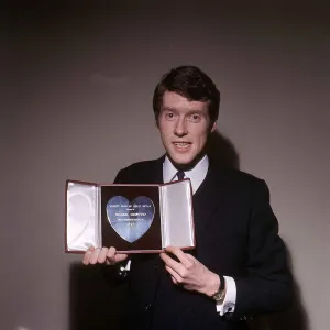 Michael Crawford Actor with his Variety Club Silver Heart Award for 1965 Michael Crawford Actor with his Variety Club Silver Heart Award for 1965