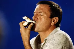 Michael Elphick Actor eating a cream cake A©Mirrorpix Michael Elphick Actor eating a cream cake A©Mirrorpix