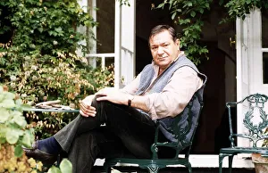 Michael Elphick Actor sitting in chair at home in garden Michael Elphick Actor sitting in chair at home in garden