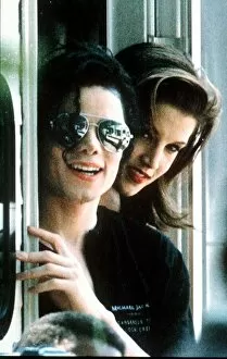 Images Dated 9th August 1994: Michael Jackson pop Singer wearing dark glasses With Lisa Marie Presley