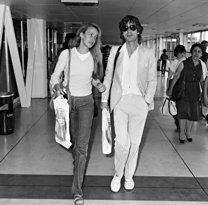 Mick Jagger and girlfriend, model, Jerry Hall, pictured at London Heathrow Airport Mick Jagger and girlfriend, model, Jerry Hall, pictured at London Heathrow Airport