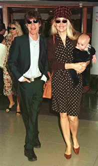 Mick Jagger pop singer and wife Jerry with their new baby leave Heathrow for Nice Mick Jagger pop singer and wife Jerry with their new baby leave Heathrow for Nice