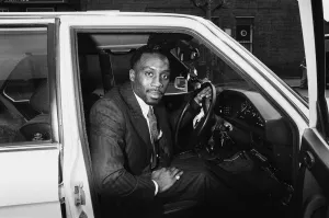 Middleweight boxer Nigel Benn posing with his 3 series BMW. Circa 1987 Middleweight boxer Nigel Benn posing with his 3 series BMW. Circa 1987