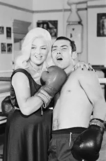 Former Middleweight Champion Alan Minter with singer and Actress Diana Dors at The Thomas Former Middleweight Champion Alan Minter with singer and Actress Diana Dors at The Thomas