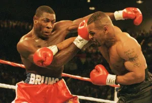 Mike Tyson launches an attack on Frank Bruno during the WBC world title fight in Las Mike Tyson launches an attack on Frank Bruno during the WBC world title fight in Las