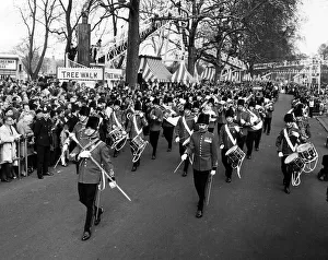 A military band leads the Battersea Easter Parade of 1971 as crowds gather to watch A military band leads the Battersea Easter Parade of 1971 as crowds gather to watch