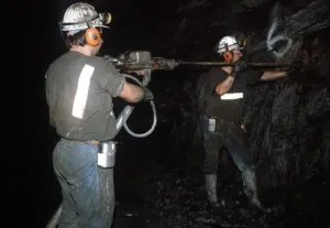 Miners drilling wall of a stope underground broken hill in New South Wales Australia Miners drilling wall of a stope underground broken hill in New South Wales Australia